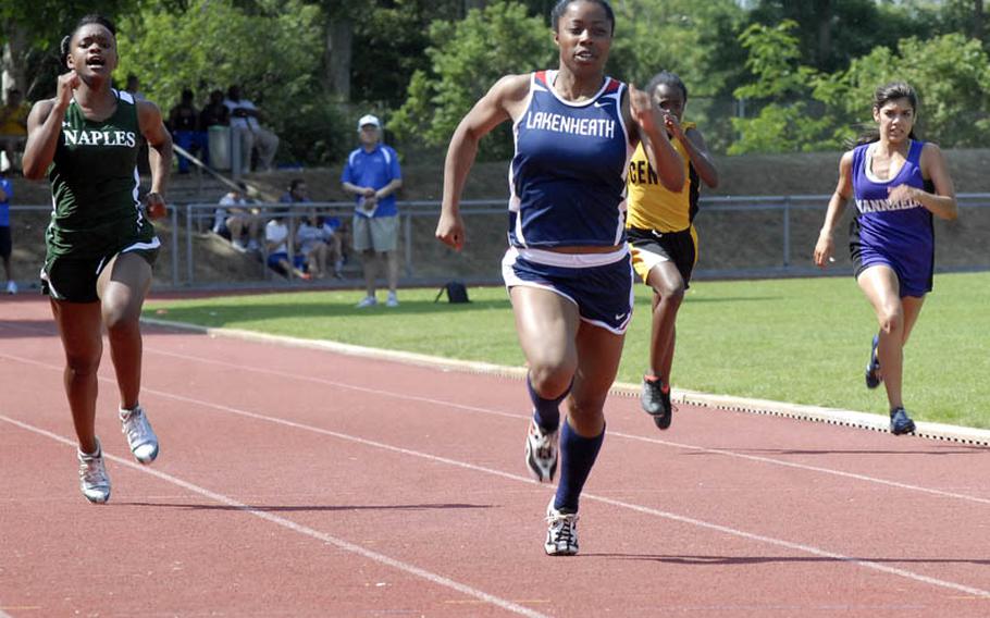 Lakenheath senior Jasmin Walker sprints ahead of, from left, Naples senior Jessica Edmondson, Vicenza freshman Ja'brea Joiner and Mannheim sophomore Grace Gonzalez,  to win the 200 meter run. Walker cruised to victory with a time of 25.60 seconds, one of four gold medals she won in the two-day DODDS Europe Track and Field Championships.