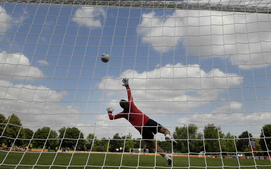 Hope Solo, the U.S. Women's National Team goalkeeper, takes a few shots during Thursday's practice session held at SG Kirchheim soccer field in Heidelberg, Germany, before the team's second 2011 World Cup game against Colombia. Many local U.S. military members and their families were invited to watch the practice session.