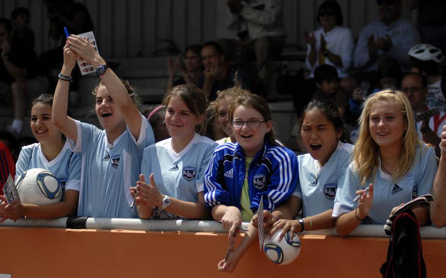 Girls from Heidelberg High School and Middle School show their support for the U.S. Women's National Team at the team's practice Thursday at SG Kirchheim soccer field before the team's second 2011 World Cup game against Colombia.