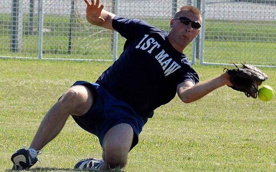 1st Marine Aircraft Wing right fielder Mathias Brause can't find the handle on a 3rd Marine Logistics Group line drive during Tuesday's pool-play game in the 2011 Marine Corps Far East Regional Softball Tournament at Camp Foster, Okinawa. Wing beat defending champion 3rd MLG, 10-3.