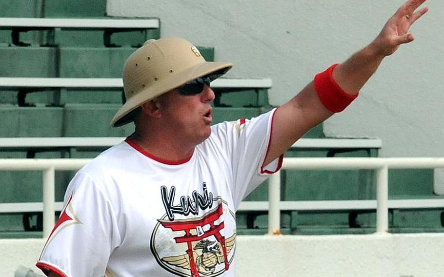 Marine Corps Air Station Iwakuni coach Keith "Apples" Applegate shouts instructions to his charges during Wednesday's pool-play game against 3rd Marine Division/III Marine Expeditionary Force in the 2011 Marine Corps Far East Regional Softball Tournament at Camp Foster, Okinawa. Division beat Iwakuni 19-8.
