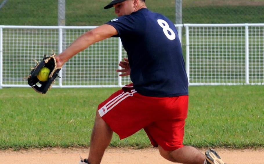 Shortstop Justin Barnes of 1st Marine Aircraft Wing backhands a 3rd Marine Division/III Marine Expeditionary Force ground ball during Friday&#39;s knockout-bracket semifinal game in the double-elimination playoffs in the 2011 Marine Corps Far East Regional Softball Tournament at Field 1, Gunners Fitness & Sports Complex, Camp Foster, Okinawa. Division ousted Wing 12-5, only to be eliminated in the knockout-bracket final game 5-4 by Marine Corps Base Camp S.D. Butler.