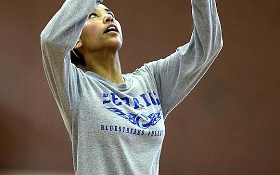 Kiona Glenn, 16, a junior from Hohenfels, Germany, prepares to set the ball Monday at this year's DODDS-Europe volleyball camp at Vilseck High School.