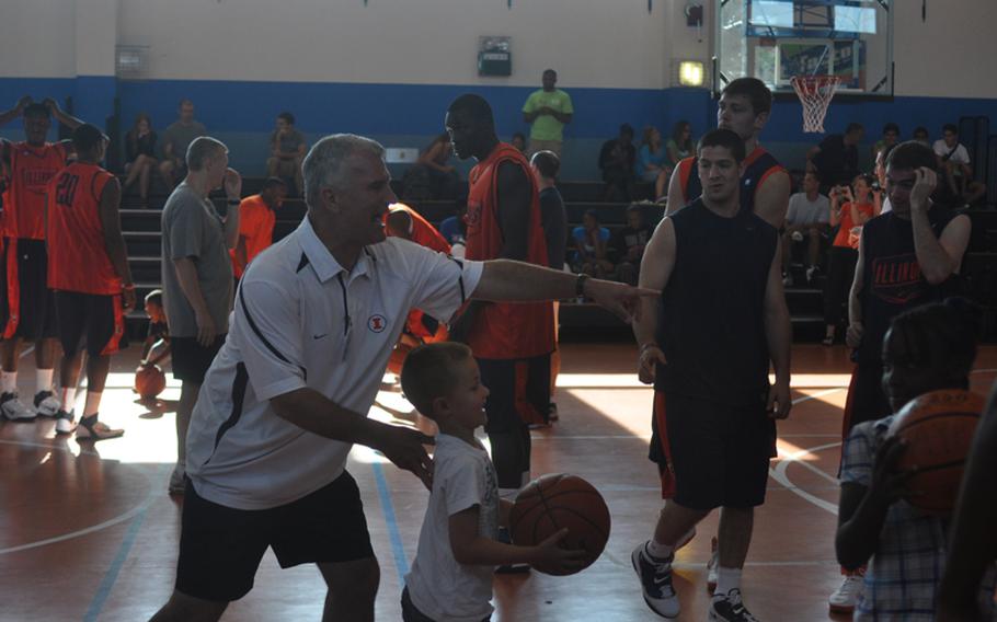 Illinois head coach Bruce Weber directs traffic Wednesday during a clinic at Aviano Air Base, Italy, put on by players and coaches from the universities of Illinois and West Virginia.