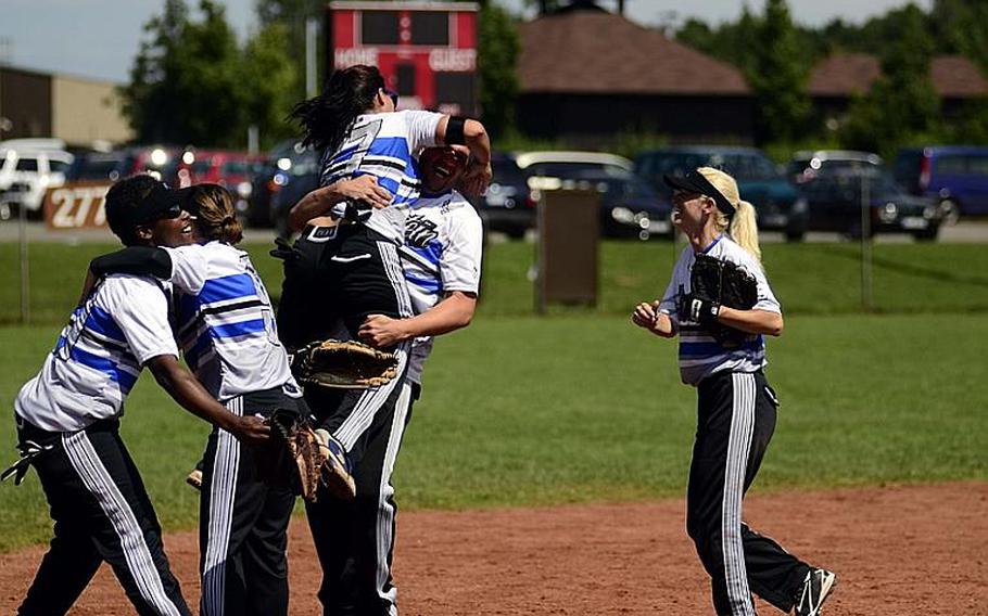 Members of Ramstein Air Base's woman's softball team celebrate after winning the U.S. Forces Europe softball championships at Spangdahlem Air Base, Germany.