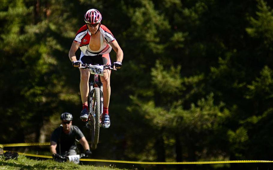 James Sharp, 49, goes airborne Saturday in the Fat Tire Spectacular Mountain Bike Race in Garmisch, Germany. Sharp finished 10th overall with a time of 54 minutes, 42.4 seconds.