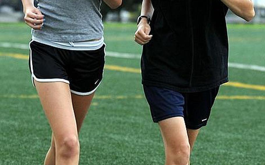 The sister duo of 2010 Far East High School Cross-Country Meet girls 3.1-mile individual race champion Amanda Henderson, right, a Seoul American senior, and runner-up Pam Henderson, a sophomore, will make the Falcons tough to beat.