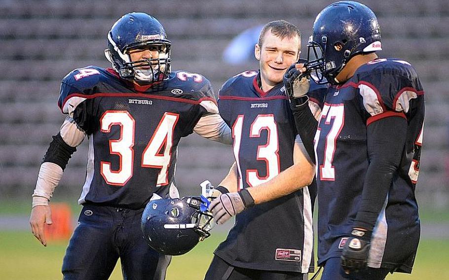 Austin Schmidt, Kyle Edgar and Darian Billups , from left, celebrate last season's  Division II title after defeating Mannheim. The trio will return for the Barons in 2011.
