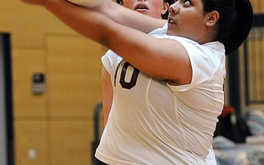 Baumholder's Leslie Pinedo returns a Kaiserslautern ball in front of teammate Sydney Giefer. The two teams won one a game apiece at the jamboree in Wiesbaden, on Saturday. Baumholder took the first game 25-19 and dropped the second 24-20 in the 35-minute match.