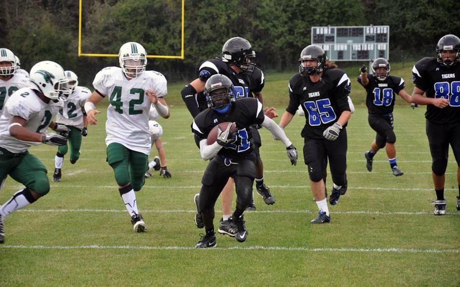 Hohenfels senior Charles Boateng breaks away from the Naples defense Saturday. Visiting Naples won the season opener 19-12.