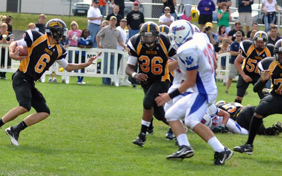 Patch quarterback LeMay Austin decides to run after a quick search for an open reciever Saturday against visiting team Ramstein. Patch beat Ramstein 26 -12.