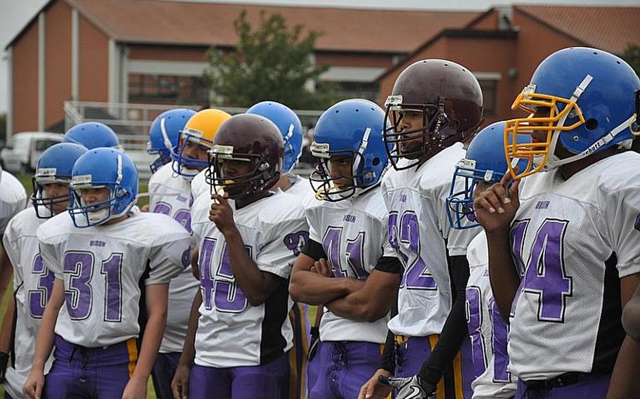 Schweinfurt High School football players observe a drill during a recent practice in Schweinfurt. The team had to borrow equipment from other DODDS-Europe schools in order to play this season.