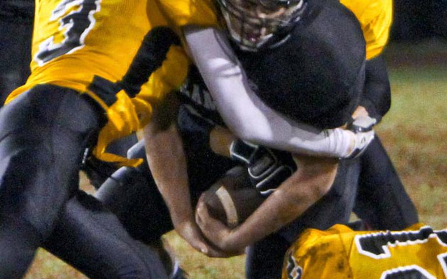 Zama American Trojans junior running back Andre Encarnacion, shown here in a game from earlier this season, ran for 243 yards and four touchdowns on 18 carries in Saturday's 42-26 home victory over Osan American. 