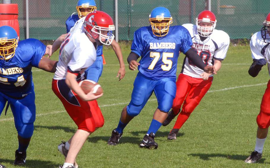 Menwith Hill all-conference quarterback Schuyler Backlar tries to break free from the Bamberg defense Saturday. Bamberg won the game 31-6, improving to 3-0.