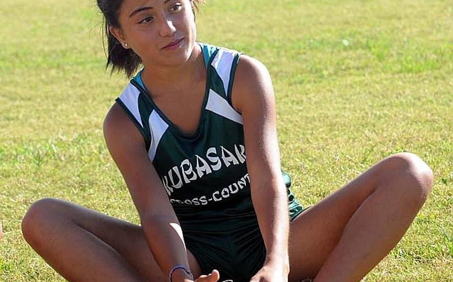 Kubasaki Dragons sophomore cross-country runner Alle Robles stretches prior toWednesday's Okinawa Activities Council's fourth cross-country meet of the season at  Camp Foster, Okinawa. Robles won 21 minutes, 29 seconds, her fastest time of the season.