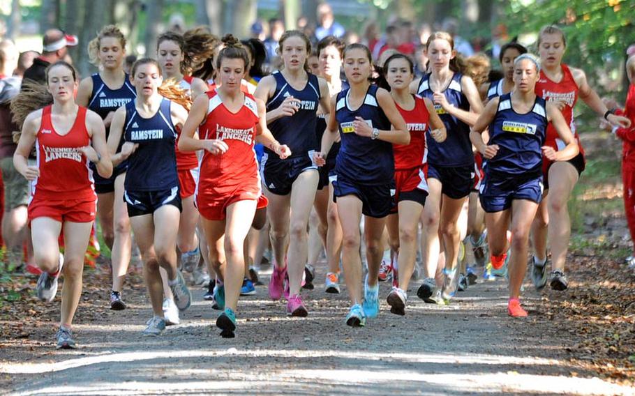 They are still in a pack at the start of the girls cross country race in Ramstein on Saturday. Anna Priddy of Ramstein, center, won the race.