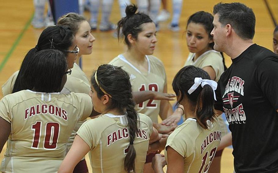 Vilseck Lady Falcons coach Brian Swenty brings his team in following a timeout Saturday. The undefeated Falcons swept their competition Bamberg and Schweinfurt.