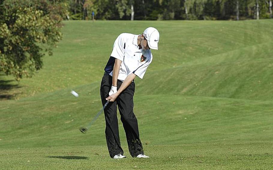 Ramstein sophomore Everett Plocek hits the ball during Thursday's high school golf tournament in Wiesbaden, Germany.