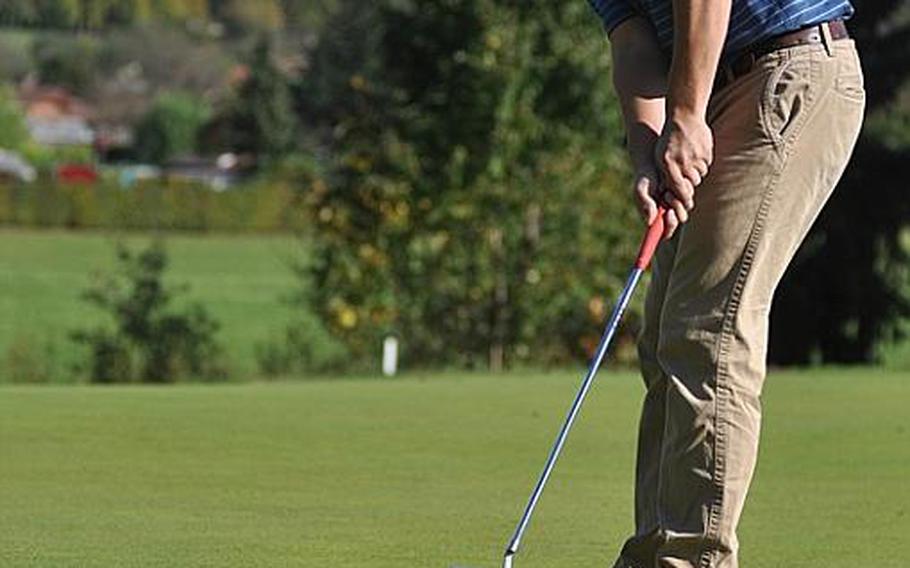 Heidelberg junior Joe Patrick putts during the front nine of a golf tournament hosted by Patch High School with visiting teams from Kaiserslautern, Heidelberg and Vilseck at the Stuttgart Golf Course Oct. 6. He won the tournament with a score of 33.