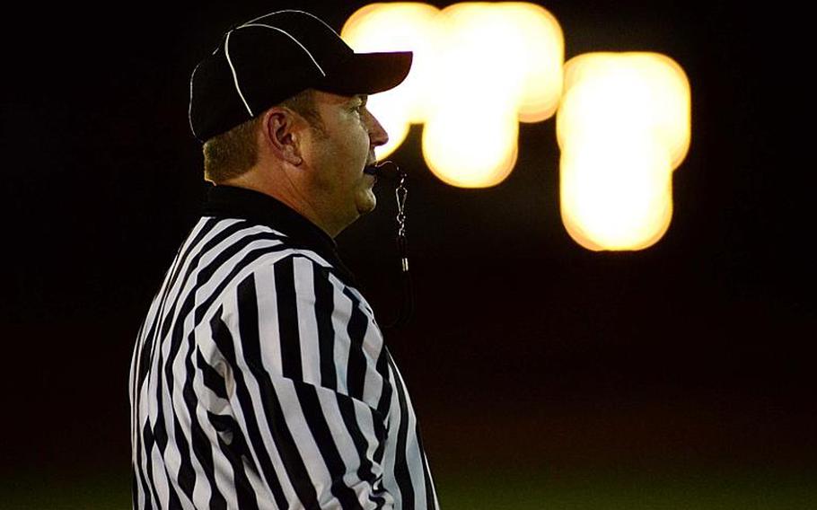 One of Friday night's officials, Walter Markwas, watches over the game.