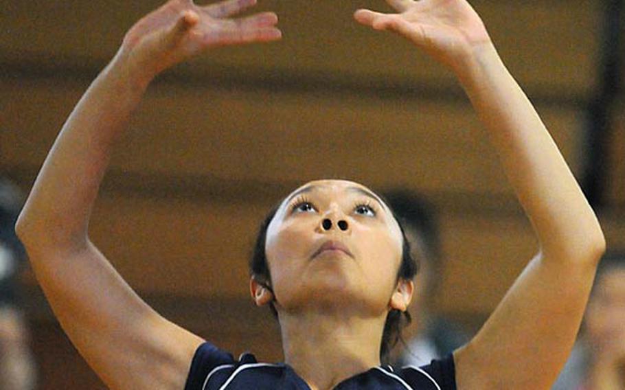 Seoul American Falcons senior Tiffaney Mitchell sets the ball against the Kadena Panthers during Saturday's match in the 2011 Okinawa District Volleyball Festivial at Kadena High School, Kadena Air Base, Okinawa. Seoul American swept Kadena 25-14, 25-19.