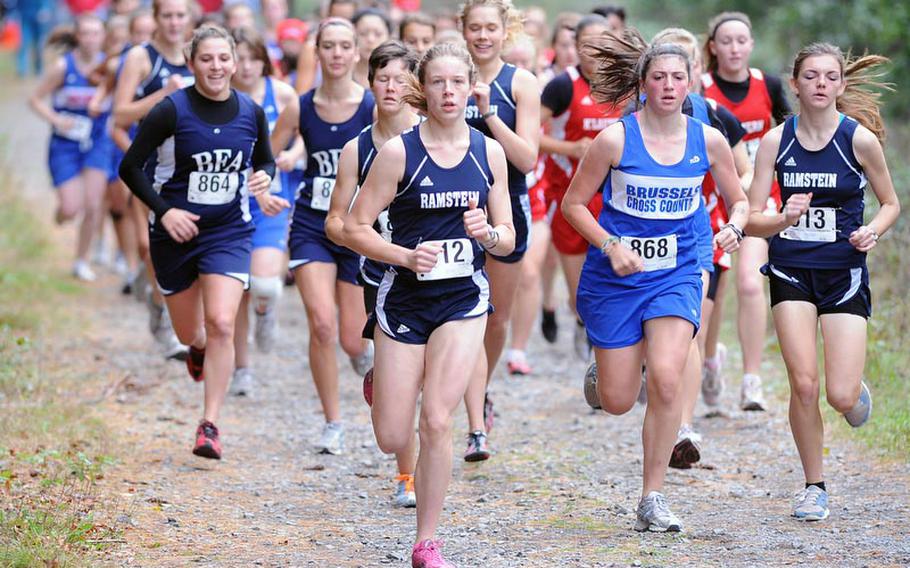 Ramstein's Anna Priddy leads the pack at the start of the cross country race in Kaiserslautern on Saturday. She won in 19 minutes, 21.7 seconds, ahead of teammates Jessica Kafer, directly behind her, Alexis Vermeire, right, and Alexandra DeFazio of Brussels, second from right.