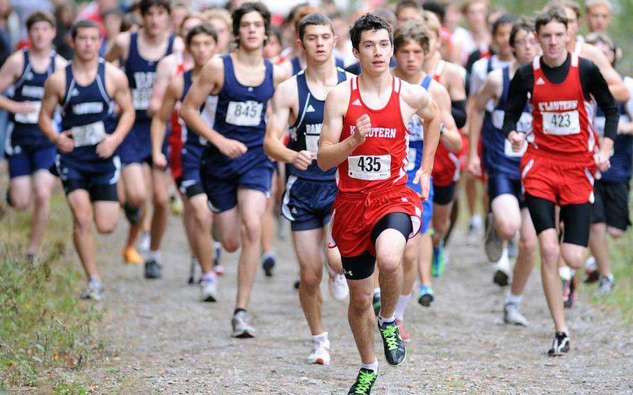 Kaiserslautern's Michael Lawson led from start to finish in the boys cross country race in Kaiserslautern on Saturday. He won the race in 16 minutes, 36.4 seconds ahead of Ramstein's Thomas Lambert, behind Lawson at left, and teammate Matt Finley, right.