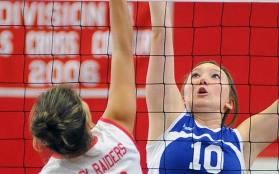 In a battle of number 10s at the net, Kaiserslautern's Grace Gonzalez-Flores, left, goes against Wiesbaden's Andrea Arnold. Wiesbaden won the match in Kaiserslautern on Saturday, 25-14, 25-19, 25-19.