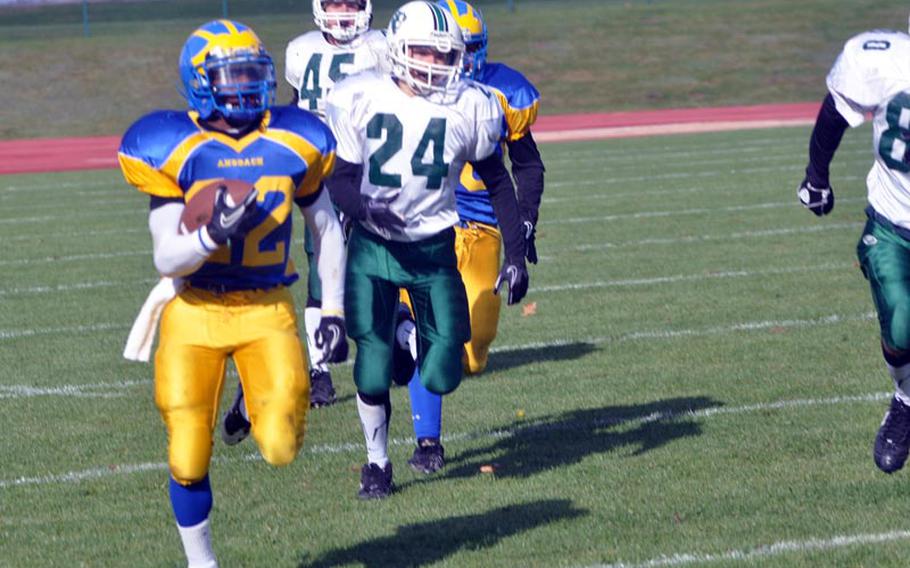 DeMar Flake of Ansbach runs up field Saturday in the Cougars' 41-40 loss to the visiting Naples Wildcats. Flake had six carries for 90 yards in the game and scored a touchdown.