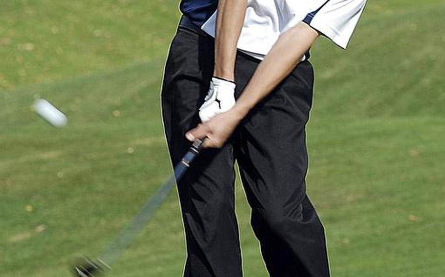 Ramstein sophomore Everett Plocek hits the ball during last week's high school golf tournament in Wiesbaden, Germany.