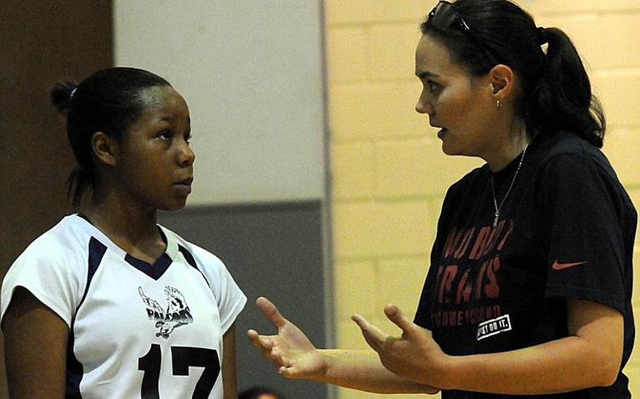 Seoul American Falcons girls volleyball coach Lori Rogers, right, gives instruction to senior Teslyn Foster during Sunday's play in the Okinawa District Volleyball Festival at Kubasaki High School, Okinawa. Rogers is in her first year of coaching the girls team after coaching the Falcons boys for 11 seasons. She succeeded longtime coach Denny Hilgar, who had six Final Four appearances.