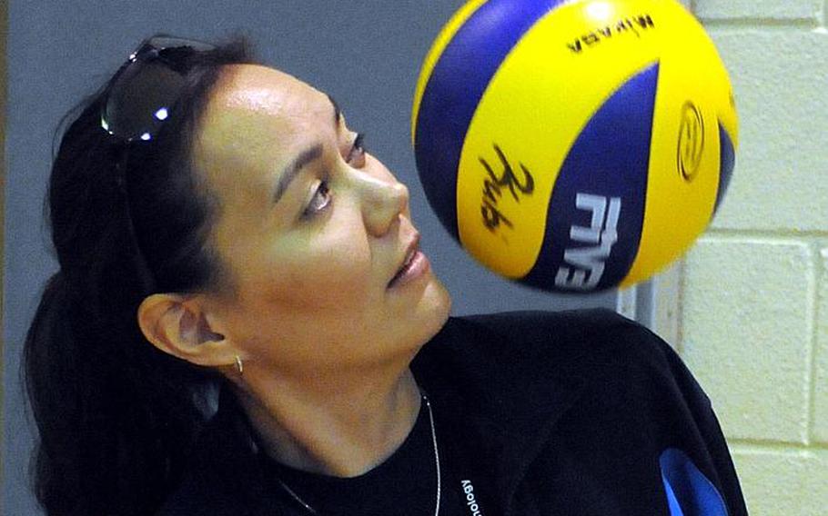 Seoul American Falcons girls volleyball coach Lori Rogers bounces the ball off her shoulder during a break in the action in Sunday's Okinawa District Volleyball Festival at Kubasaki High School, Okinawa. Rogers played for the Falcons from 1988-91 under her predecessor, Denny Hilgar, and coached the Falcons boys team for 11 seasons before assuming the girls helm in August.