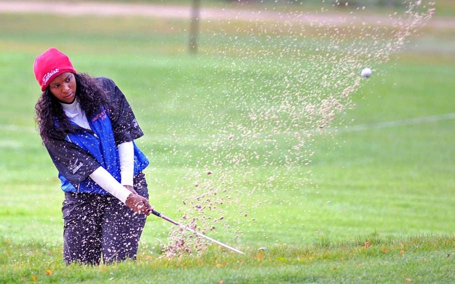 Ramstein's Diana Green kicks up sand as she knocks her ball out of the bunker on the third hole in the opening round of the DODDS-Europe golf championships at the Heidelberg Golf Club on Thursday. Green had a 20 using a modified Stableford scoring system.