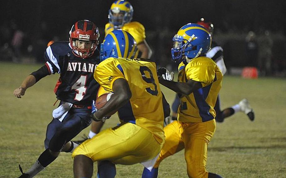 Aviano safety Corey Webb faces off against Ansbach's Xavier Jones in Ansbach's 70-42 victory over the Saints on Friday night. Jones rushed for 323 yards - the third straight game he's topped 300 - and scored six touchdowns.