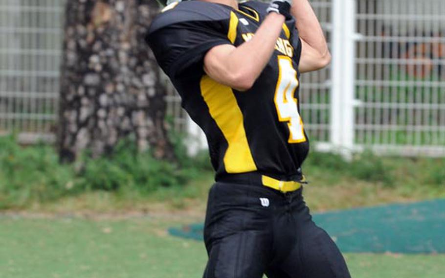 American School In Japan Mustangs receiver Charlie Seno can't find the handle on the ball in the end zone against Nile C. Kinnick Red Devils during Saturday's Kanto Plain Association of Secondary Schools football game in Tokyo. ASIJ won 35-6.