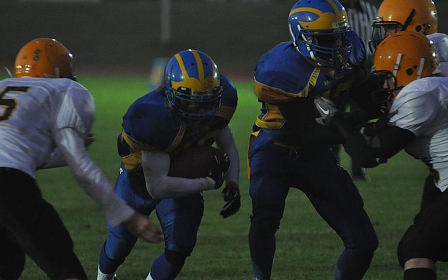 Ansbach junior DeMar Flake runs in a 2-point conversion Friday night against SHAPE in the Division-II quarterfinals in Ansbach. Flake ran seven times for 82 yards and scored two touchdowns. Ansbach won the game 66-13.