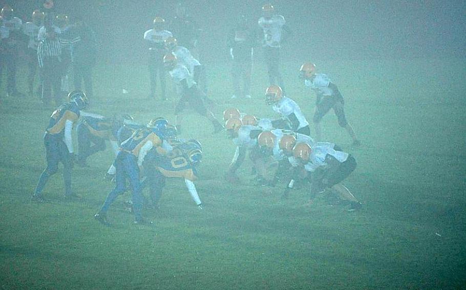 The DODDS-Europe Division II football quarterfinal game Friday night at Ansbach ending up with SHAPE and the home team playing in a heavy fog as illustrated by this photo. Ansbach, the top seed in Division II-South, advanced with a 66-13 victory.