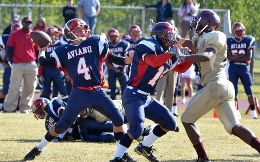 Aviano quarterback Corey Webb goes back to pass Saturday in the Saints' 48-24 victory over Baumholder. Webb, who completed eight of 10 passes for 172 yards, found Andrew Bert for a 37-yard touchdown on the play.