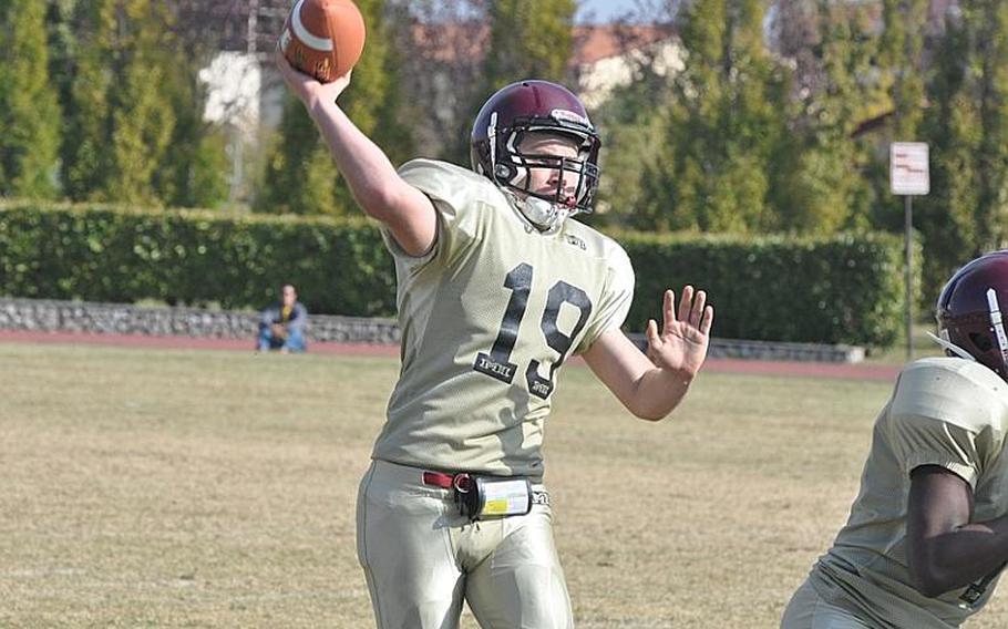 Baumholder quarterback Christian Kubas tries to connect with Ben McDaniels on a pass Saturday in the Bucs' 48-24 loss to Aviano.