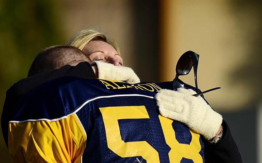 Pam Allmon comforts her son Caelan as he played his last game as a high school football player. Heidelberg needed to win Saturday's game to make the playoffs.