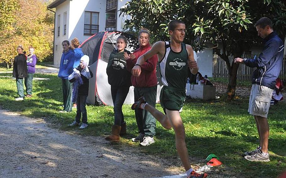 Naples' John Fain crosses the finish line with a new course record of 17 minutes, 9 seconds Saturday in a dual meet at Parco San Floriano near Polcenigo, Italy. Fain will be one of the favorites at next week's DODDS-Europe Cross Country Championships in Germany.
