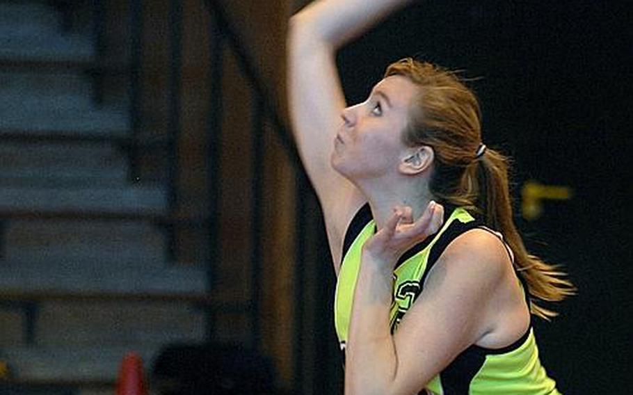 Alconbury's Ashley Steele serves the ball during a game against the Brussels Brigands on Saturday at RAF Lakenheath, England. The Dragons defeated the Brigands in three straight games.
