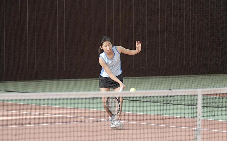 Freshman Haley Tan, half of the top-seeded International School of Brussels doubles team, tries to catch up with the ball at the Hochheim Tennis Center during Day Two action of the DODDS-Europe tennis championships.