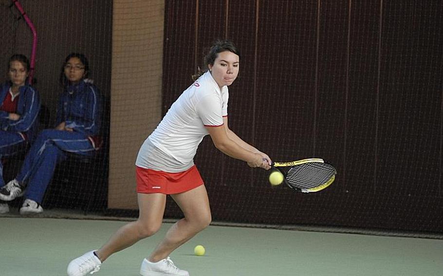 Senior Ashley Metzler of the American Overseas School of Rome tries to hit the ball back during Day Two girls double action at the DODDS-Europe tennis championships.