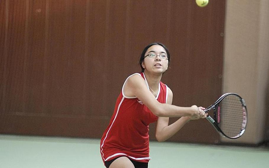 Ramstein senior Michaela Corral watches the ball approach her during Friday girls doubles action at the Hochheim Tennis Center.