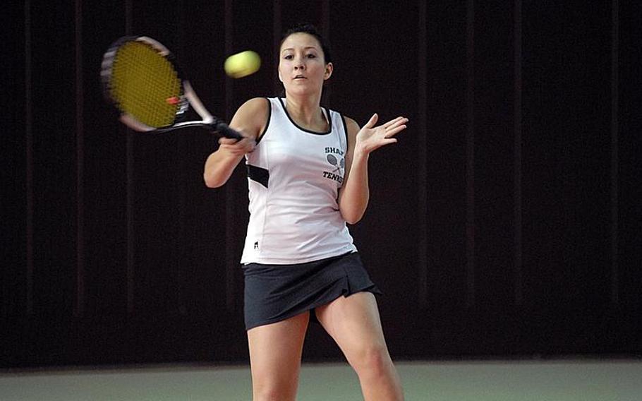 SHAPE senior Selena Suparman makes contact with the ball Friday during girls doubles action of the European Tennis Championships.