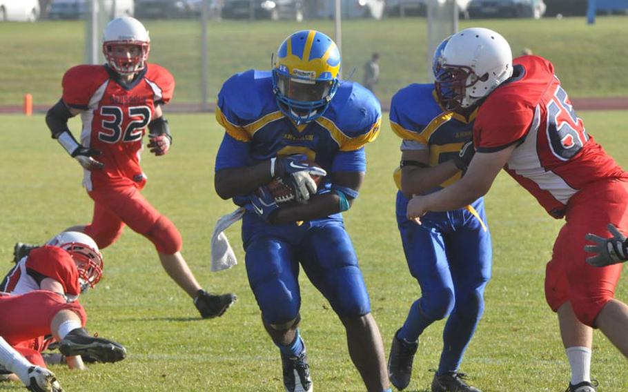 Ansbach senior runningback Xavier Jones rushes downfield Saturday. Jones rushed 27 times for 175 yards and a touchdown in the Cougars' 26-12 semifinal win over the visiting Raiders.