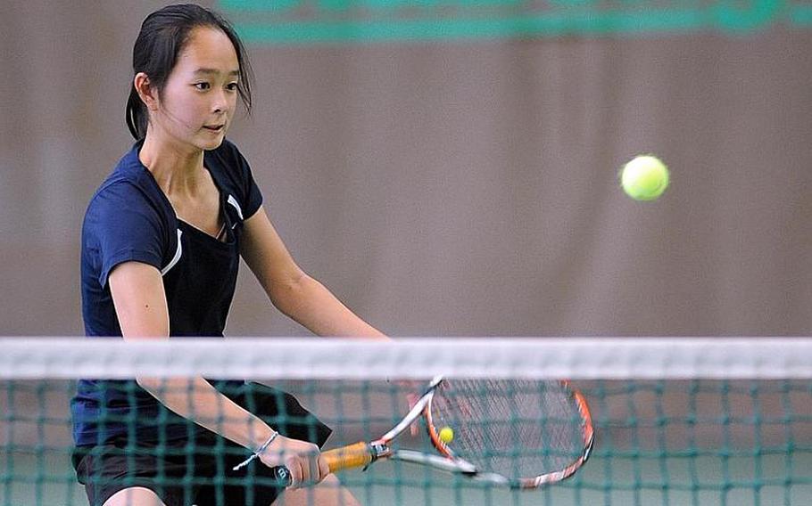 Sayaka Goto of International Schools of Brussels returns a shot at the net in the girls doubles finals at the DODDS-Europe tennis finals in Wiesbaden on Saturday. Goto and teammate Haley Tan beat Ramstein's Olivia Rockwell and Michaela Corral 6-2, 6-3 for the title.
