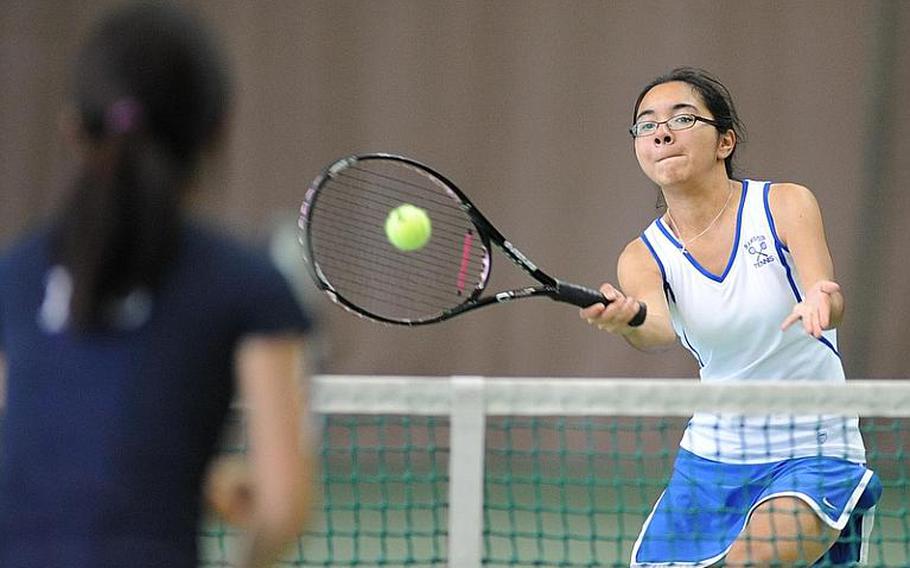 Ramstein's Michaela Corral returns a shot in the girls doubles final at the DODDS-Europe championships on Saturday. Corral and teammate Olivia Rockwell fell to ISB's Sayaka Goto and Haley Tan 6-2, 6-3.