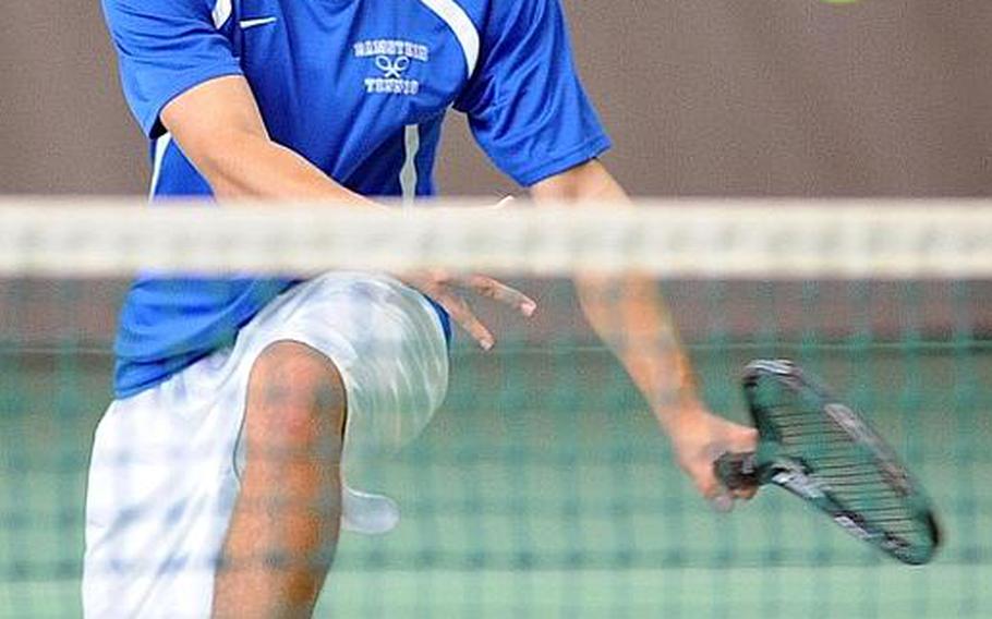 Forrest Kamperman of Ramstein returns a shot at the net in the boys doubles final at the DODDS-Europe tennis championships on Saturday.Kamperman and his partner Aryan von Eicken fell to Sergio Valdes and Shotaro Shobu of International School of Brussels 0-6, 6-4, 7-6 (12-10).